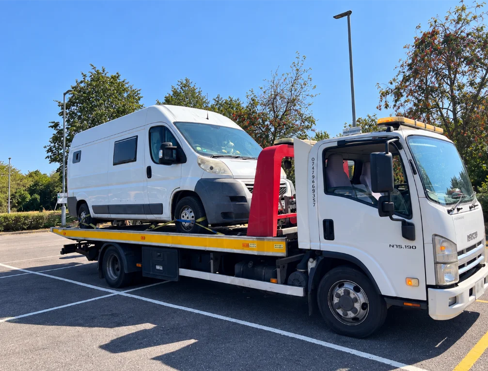 Isuzu Flatbed Tow Truck with Loaded Van London
